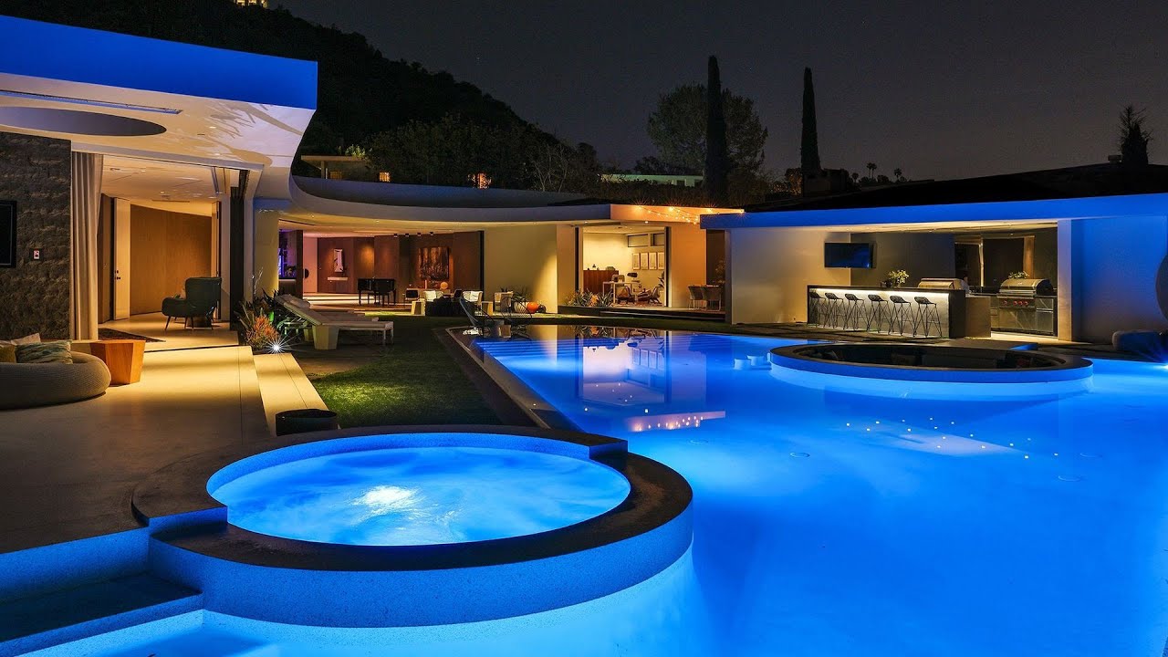 image 0 A Mid Century Modern Oasis With Flared Pool Edge Features The Pinnacle Of Beverly Hills Style
